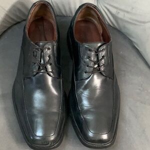 Johnston Murphy black leather, sheepkin insole.